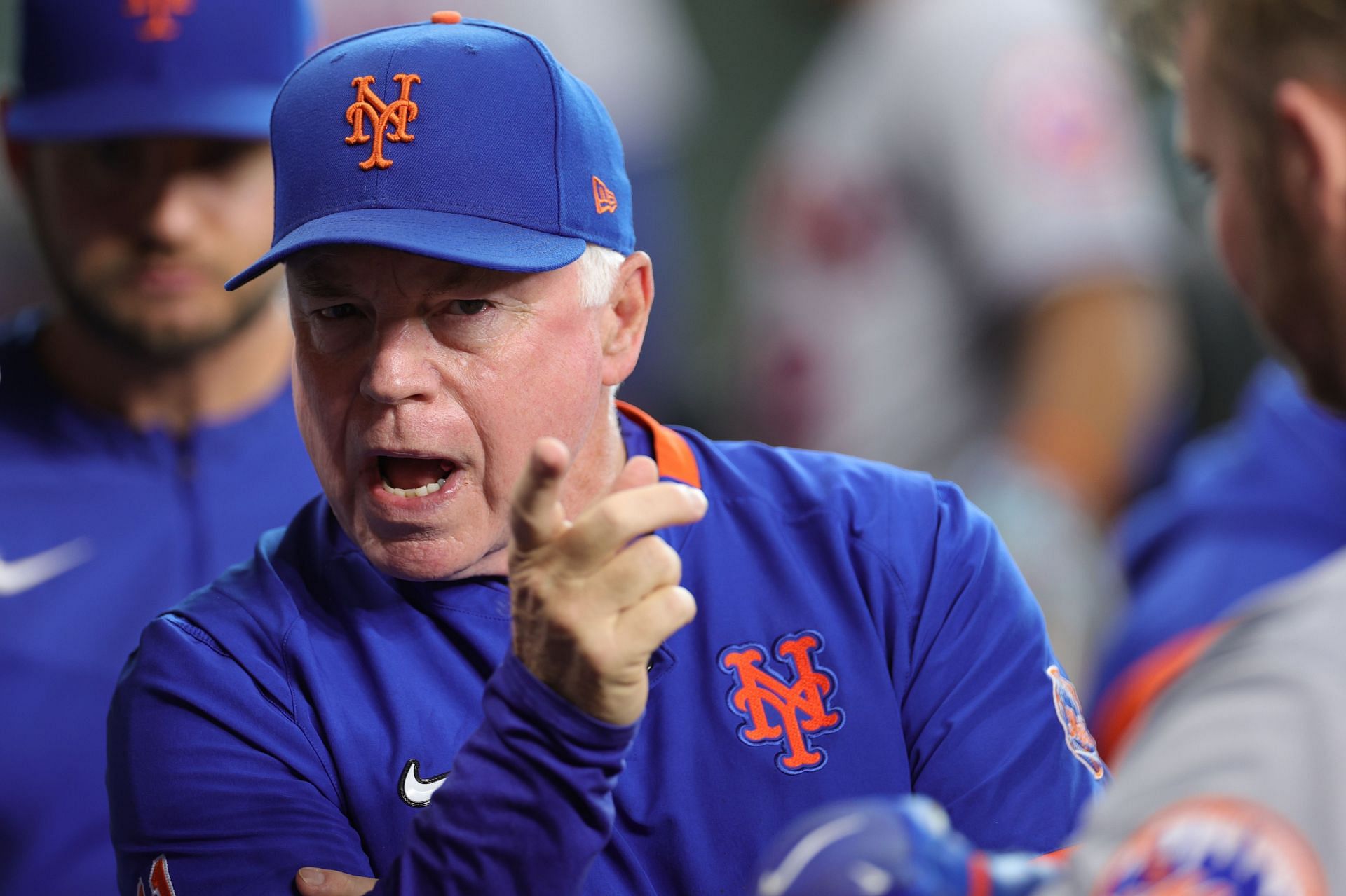Buck Showalter looks on from the dugout during a game against the Houston Astros at Minute Maid Park